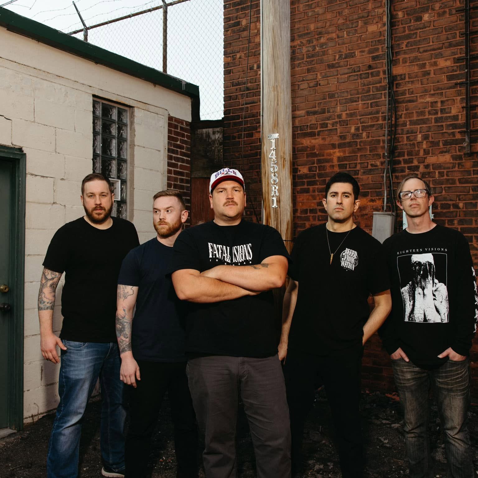It Dies Today standing together in an alley in Buffalo